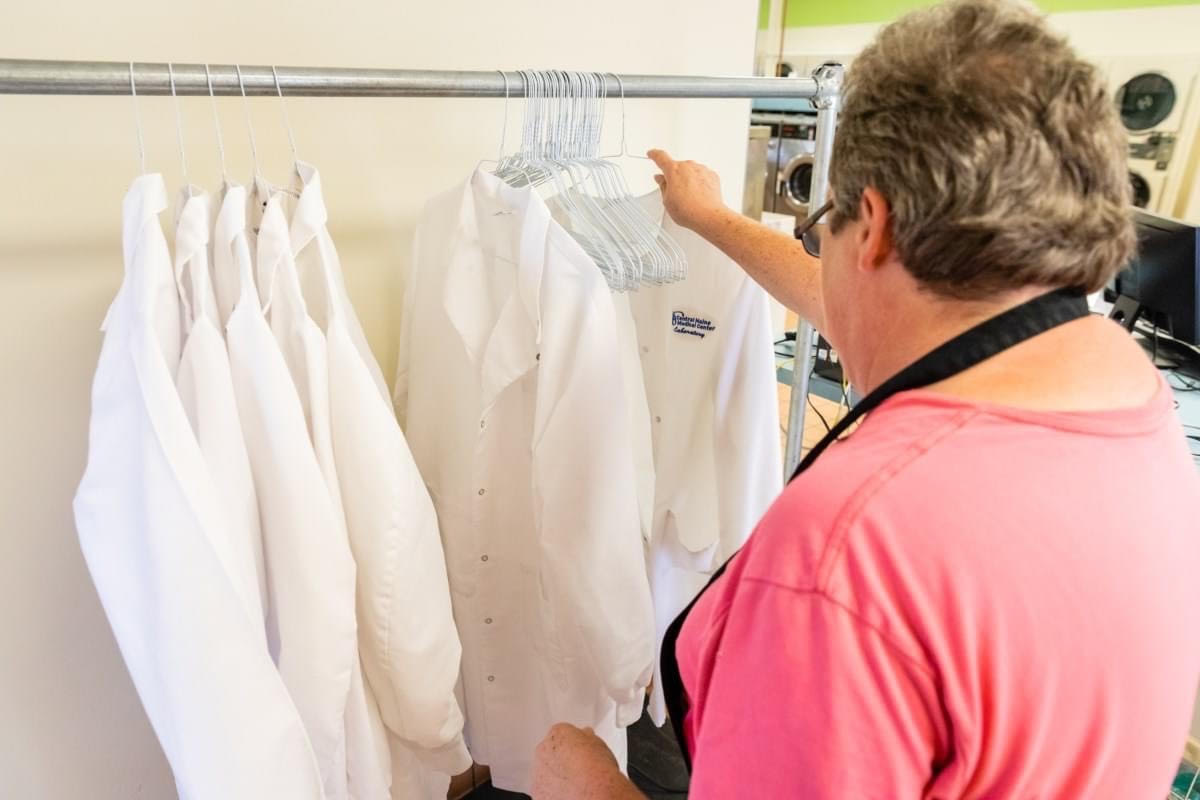 a man cleaning clothes